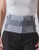 Front view of the Push med Back Brace worn over clothing, highlighting adjustable straps, anatomical fit, and compression for lower-back stability.