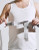 User fitting Push med Shoulder Brace around torso, highlighting adjustable fixation straps for customised support and comfort during shoulder rehabilitation.