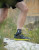 Lightweight ankle support worn during walking to provide stability and comfort on varied terrain