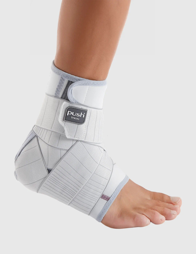 Push med ankle brace providing firm compression and adjustable strap support for ankle sprains, instability and everyday recovery.