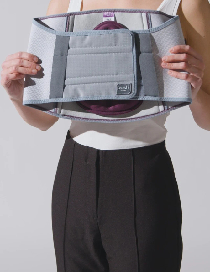 Front view of Push care Back Brace being applied, demonstrating adjustable compression straps for customised lumbar support.