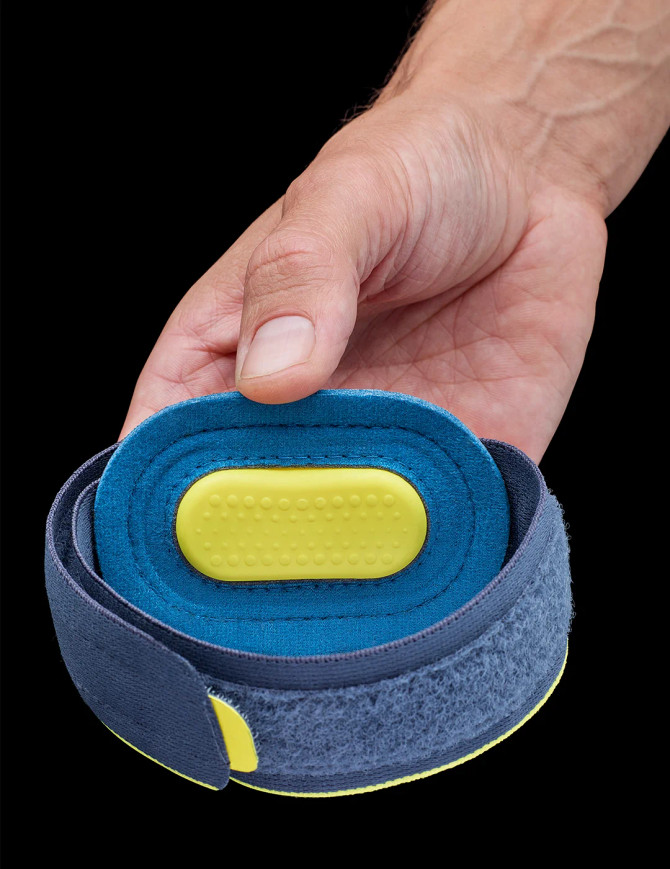 Close-up of the Push Sports Elbow Brace showing the yellow pressure pad designed to reduce tendon strain