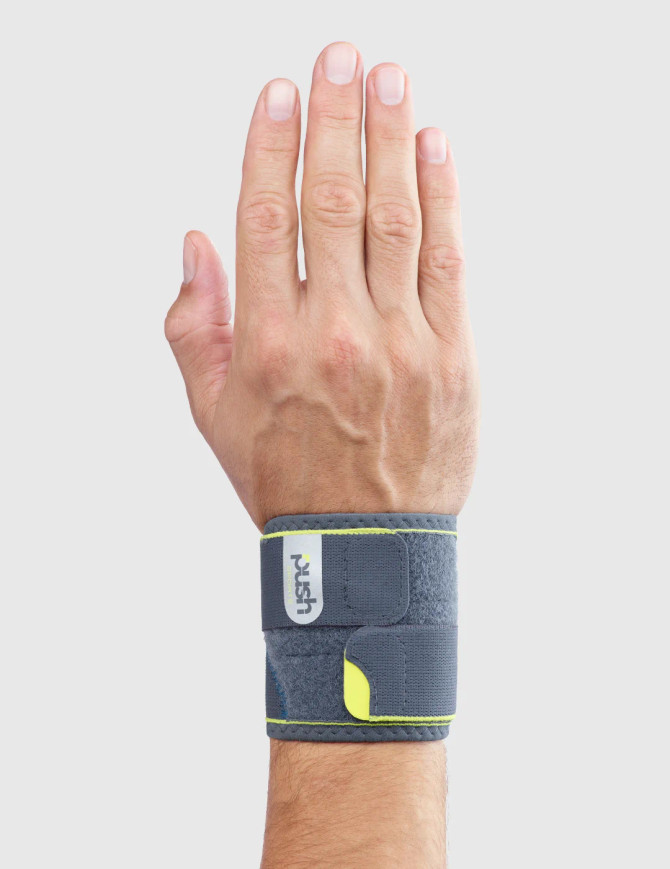 Push Sports Wrist Support displayed on the wrist showing its slim, low-profile design