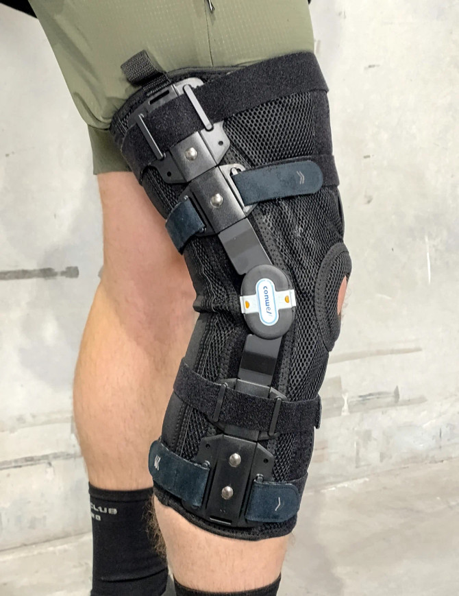 Conwell Medical Defender Mesh ROM knee brace featuring bilateral hinges for controlled knee stability