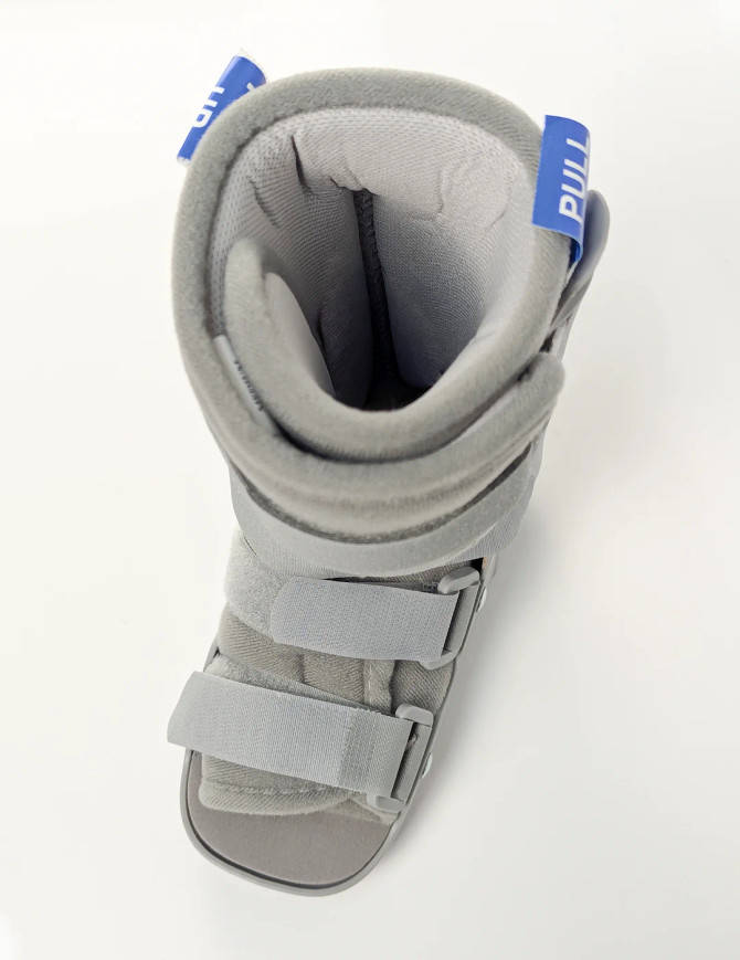 Top-down view of children’s medical walker boot highlighting cushioned interior and easy-adjust fastening system.