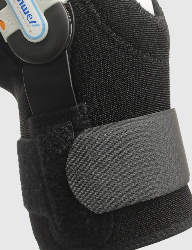 Conwell Medical 5755 knee stabiliser shown slightly flexed to demonstrate controlled knee movement during rehabilitation