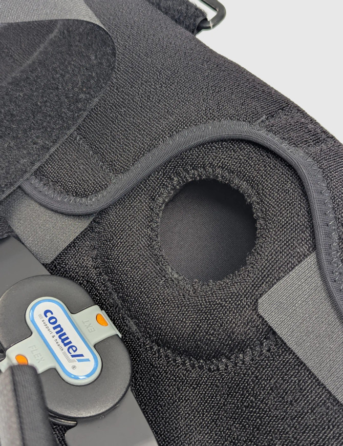 Wrap-around hinged knee support offers reliable stability for everyday wear during healing.