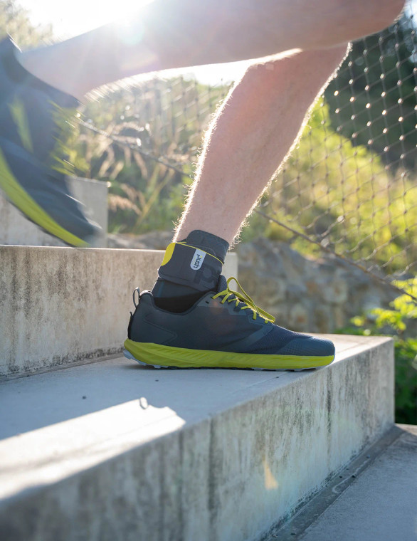 Ankle brace in use during outdoor jogging, offering secure support without restricting movement