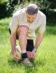 Lifestyle image of Push ankle brace being secured outdoors, supporting ankle ligaments during activity and recovery.