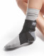 Side view of Push ortho ankle brace worn over sock, designed to restrict inversion and eversion while allowing natural plantar and dorsal flexion.