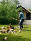 Active lifestyle image of Push med Elbow Brace Epi worn while chopping wood for repetitive strain elbow support.