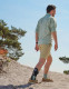User stepping outdoors with Push ortho AFO providing ankle stability and mobility support.