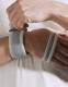 Detailed view of wrist and arm support section of Push med Shoulder Brace, illustrating padded cuff and adjustable strap for controlled arm positioning during recovery.