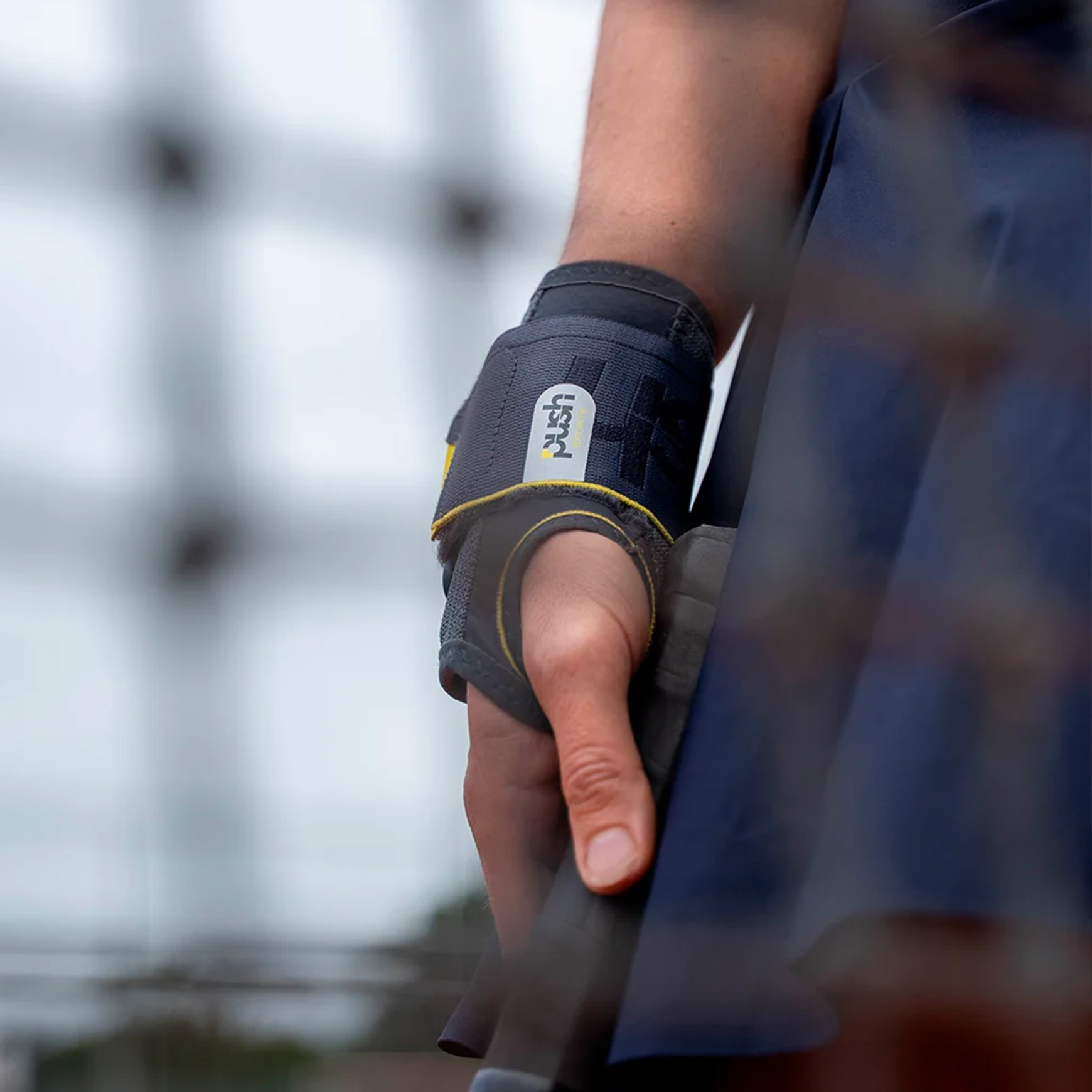 Close-up of the Push Sports Wrist Brace being worn during a tennis match.
