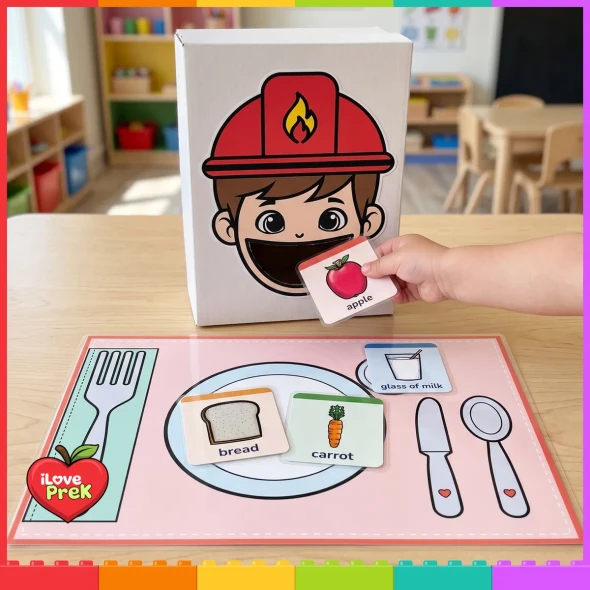 Child feeding an apple card to the firefighter shoe box feeder.