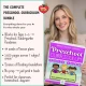 Teacher holding iLovePreK printed lesson plans and curriculum objectives