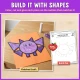 Build it with shapes: the finished bat craft next to its build mat with dashed shape outlines.