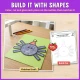 Build it with shapes: the finished spider craft next to its build mat with dashed shape outlines.