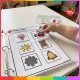 Toddler placing the drum card on its shadow in a busy binder.