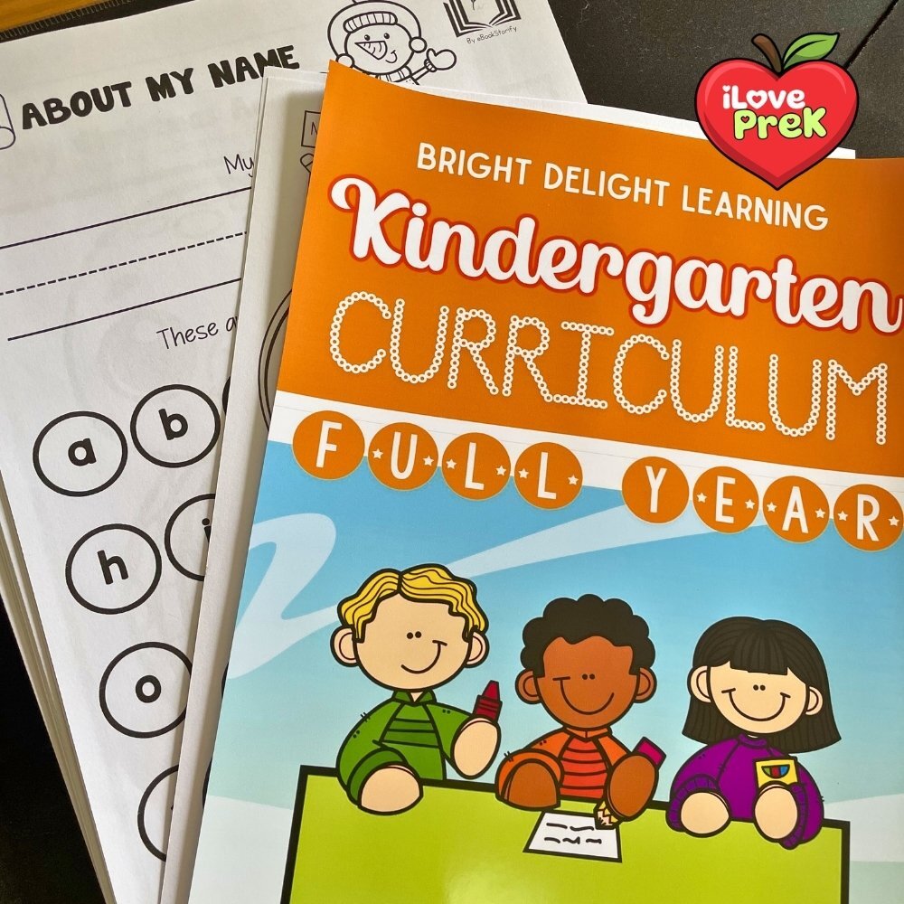 Kindergarten curriculum printed pages laid out on a table by iLovePreK