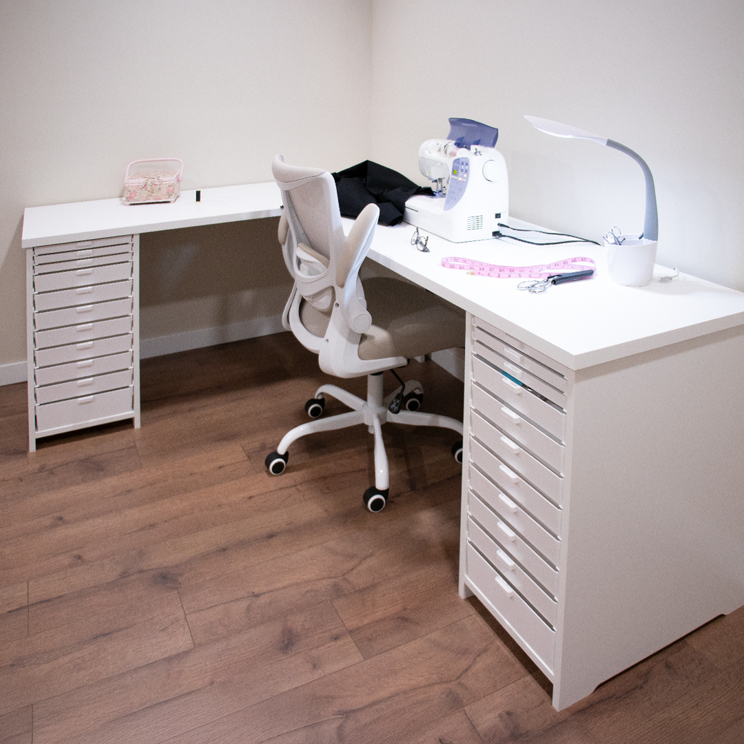 A finished, organized craft workspace with a coordinated desk and drawer storage