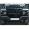 Britpart XS Facelift Kit | Gloss Black Grilles & Mirrors with Silver Mesh for Defender, front view of a black Land Rover Defender showcasing the aftermarket gloss black grille, silver mesh, and matching mirrors. Britpart XS Facelift Kit | Gloss Black Grilles & Mirrors with Silver Mesh for Defender, front view of a black Land Rover Defender showcasing the aftermarket gloss black grille, silver mesh, and matching mirrors.