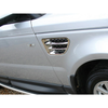 Britpart Air Intake Wing Grille Chrome Pair for Range Rover Sport L320, close-up of chrome finish vent grille on silver SUV side panel.