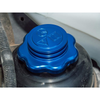 Britpart Aluminium Power Steering Reservoir Cap With Cooling Fins for Defender, close-up of a blue aluminium cap with cooling fins on a vehicle's power steering reservoir.