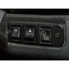 Britpart Black Aluminium Switch Panel for Defender, close-up of three black switch buttons for vehicle functions.