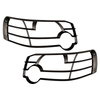Product: Direct Replacement Front Lamp Guard Pair for Freelander 1, black protective front lamp guards for vehicle headlights.