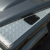Britpart Silver Painted Wing Top Chequer Plate Set for Defender, close-up of silver painted chequered metal footplate with a black air vent on a Land Rover Defender vehicle.