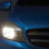 Ring Automotive H4 Xenon Performance 150 Halogen Headlamp Bulb Pair Ring, car's blue front headlight illuminated with other vehicle parts in the background. Ring Automotive H4 Xenon Performance 150 Halogen Headlamp Bulb Pair Ring, car's blue front headlight illuminated with other vehicle parts in the background.