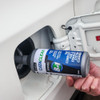Cataclean Diesel additive being poured into vehicle fuel tank