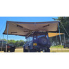 Vehicle mounted 270 degree awning creating shaded camping and working area