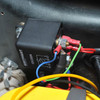 Britpart Microprocessor Controlled Dual Battery Management System, close-up of the black rectangular control unit with wiring connections for vehicle battery management.