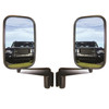 Direct Replacement Door Wing Mirrors with Arms (Pair) - MTC5217 for Defender 90/110/130, side view of two black wing mirrors showing reflective surfaces reflecting a Land Rover Defender vehicle on grassy terrain under a blue sky.