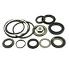 Direct Replacement Power Steering Box Seal Kit 4 Bolt, image showing a collection of black rubber seals, O-rings, and a small metal fitting used for repairing Land Rover Defender and Discovery 1 steering systems.