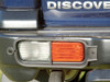 Rear Low Lamp Guard Pair for Discovery 2, black plastic protective guards for rear low lamps in a pair.