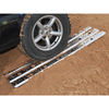 Britpart Aluminium Sand Track Recovery Ladders, metal recovery ladders placed on sandy terrain with a Land Rover vehicle tire for off-road recovery.