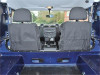 Britpart Bulkhead Reduction Bar Kit for Defender, interior view showing the front seats and dashboard of a Defender vehicle.