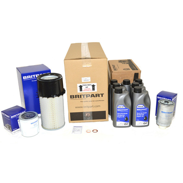 Britpart Engine Service Filter Kit With 10W40 Engine Oil for Defender 200Tdi 1990-1994, complete set of oil filters, engine oil bottles, and related parts on a white background.