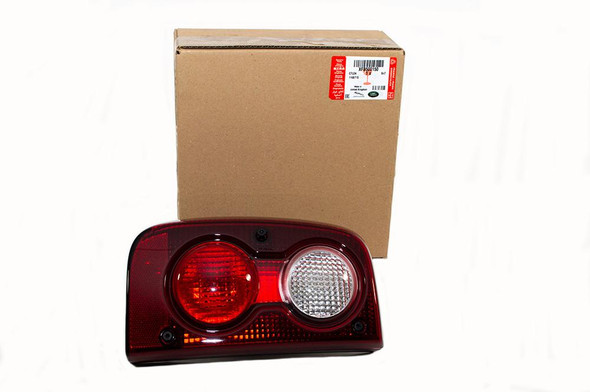 Genuine Land Rover Rear Left Hand Side Upper Tail Light for Freelander 1, image shows the tail light assembly with red and white sections placed beside its packaging box.