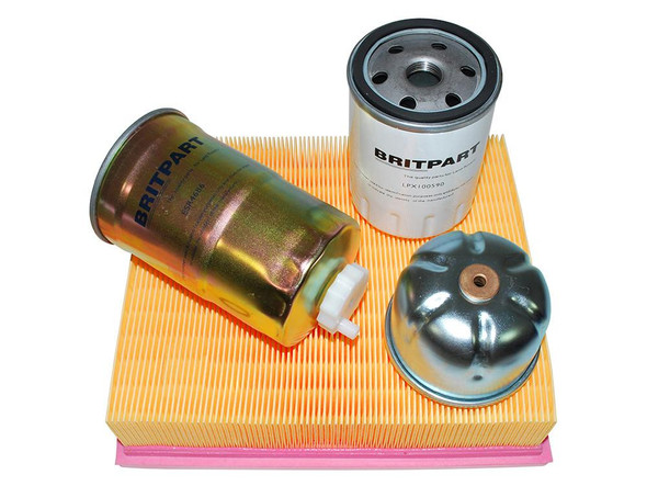 Britpart Engine Service Filter Kit for Discovery 2 Td5, contains oil filter, air filter, and filter housing components placed on a yellow and pink filter element.