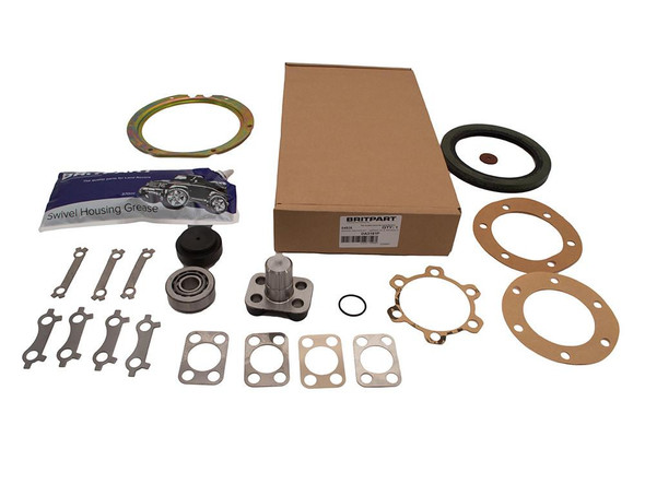 Britpart Swivel Housing Repair Kit Without Housing for Series 2A, 3, automotive parts and components in a repair kit including gaskets, seals, bearings, and other hardware arranged around a brown box. Britpart Swivel Housing Repair Kit Without Housing for Series 2A, 3, automotive parts and components in a repair kit including gaskets, seals, bearings, and other hardware arranged around a brown box.