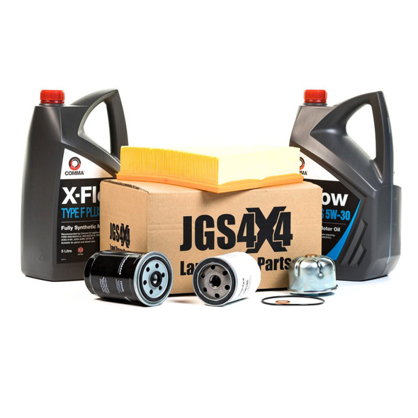 Direct Replacement Engine Service Filter Kit & X-Flow Fully Synthetic Engine Oil for Defender Td5, automotive oil filters, synthetic oil bottles, and filter components arranged together.