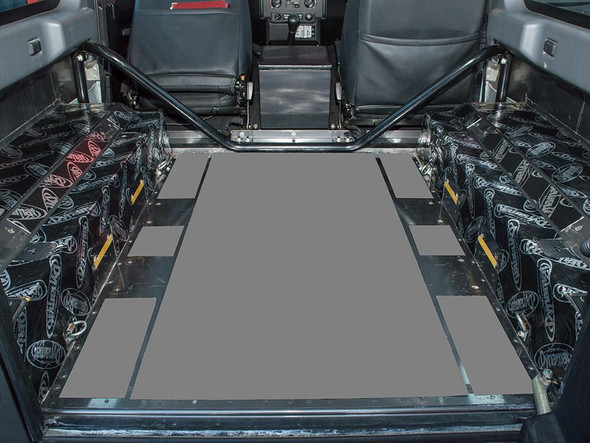 DYNAMAT  Rear Wheel Arches Soundproofing Kit for Defender 90 Puma, installed in the vehicle's rear wheel arch area for noise reduction.