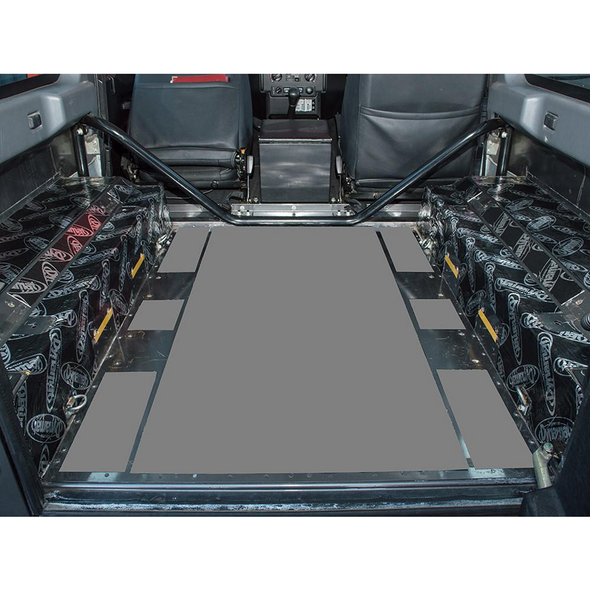 DYNAMAT  Rear Wheel Arches Soundproofing Kit for Defender 90 Puma, installed in the vehicle's rear wheel arch area for noise reduction.