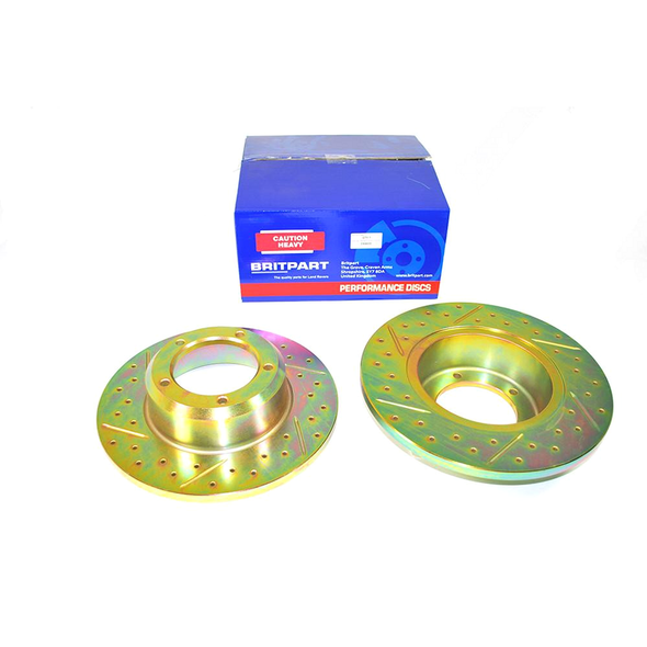 Britpart Front Solid Brake Discs Drilled and Grooved Performance Upgrade for Defender, perched in front of a blue box with branding and safety labels.