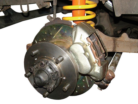 Britpart Front Solid Brake Discs Drilled and Grooved Performance Upgrade for Discovery 1, close-up view of the drilled and grooved brake discs with brake caliper and suspension components.