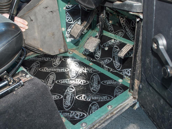 DYNAMAT  Front Footwell Soundproofing Kit - DA8094, installed in the footwell area of a Land Rover Defender, with soundproofing material applied to reduce noise and vibrations.